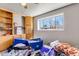Bedroom features a window for natural light at 15640 E Eldorado Dr, Aurora, CO 80013