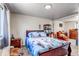 Comfortable bedroom boasts ample natural light, soft carpet, and closet space at 15640 E Eldorado Dr, Aurora, CO 80013