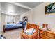 Comfortable bedroom boasts ample natural light, soft carpet, and closet space at 15640 E Eldorado Dr, Aurora, CO 80013