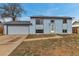 Charming two-story home features a light blue exterior, attached garage, and well-lit entrance at 15640 E Eldorado Dr, Aurora, CO 80013