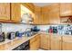 Functional kitchen features classic cabinetry, stainless steel appliances, and laminate countertops at 15640 E Eldorado Dr, Aurora, CO 80013