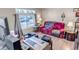 Cozy living room features hardwood floors, bright windows, and comfortable seating area at 15640 E Eldorado Dr, Aurora, CO 80013