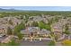 Aerial view showcasing the community, landscaped grounds and nearby parking at 7413 S Quail Cir # 1435, Littleton, CO 80127