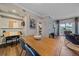 The dining room features wood floors, neutral walls, and is adjacent to both a living room and kitchen at 7413 S Quail Cir # 1435, Littleton, CO 80127