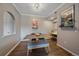 The dining room features wood floors, neutral walls, and stylish decor at 7413 S Quail Cir # 1435, Littleton, CO 80127
