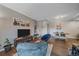 A cozy living room featuring neutral walls and an adjacent dining area at 7413 S Quail Cir # 1435, Littleton, CO 80127