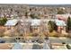 Aerial view of a brick apartment complex surrounded by mature trees in a residential neighborhood at 3249 W Fairview Pl # 207, Denver, CO 80211