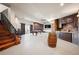 Entertaining basement space with a pool table, bar area, and exposed brick accents for a rustic touch at 19205 Sixpenny Ln, Monument, CO 80132