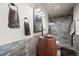 Unique bathroom with a custom wood barrel sink and a glass-enclosed shower at 19205 Sixpenny Ln, Monument, CO 80132