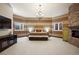 Spacious bedroom with stone fireplace and windows for natural light at 19205 Sixpenny Ln, Monument, CO 80132