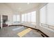 Light-filled exercise room with natural light, tile floors, and ample space for yoga and fitness at 19205 Sixpenny Ln, Monument, CO 80132