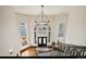 Grand foyer with staircase, high ceilings, and ample natural light pouring through the large, arched windows at 19205 Sixpenny Ln, Monument, CO 80132