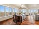 Bright kitchen features an island with counter seating and scenic outdoor views from the expansive windows at 19205 Sixpenny Ln, Monument, CO 80132
