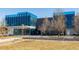 Modern commercial building with expansive glass windows, perfect for office or retail, near a garden at 9061 E 14Th St, Aurora, CO 80010