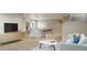 Open-concept living area with modern decor and seamless flow to the kitchen at 9061 E 14Th St, Aurora, CO 80010