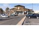 The Town Center shopping area features a modern facade with ample parking, indicating a vibrant retail environment at 9061 E 14Th St, Aurora, CO 80010