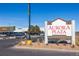 The Aurora Plaza sign is prominently displayed near a shopping center parking lot with various retail stores at 9061 E 14Th St, Aurora, CO 80010