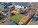 Aerial view of a backyard featuring a wooden deck, lush lawn, shed, and fenced perimeter at 19792 E Bates Dr, Aurora, CO 80013