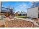 Backyard with deck, storage shed, garden plot, and patio, creating an inviting outdoor space at 19792 E Bates Dr, Aurora, CO 80013