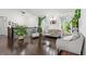 Bright living room with hardwood floors, neutral furniture, and large windows at 19792 E Bates Dr, Aurora, CO 80013