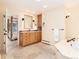 Bright bathroom featuring a stone floor, soaking tub, and wood vanity at 2552 E Alameda Ave # 16, Denver, CO 80209