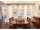 Formal dining area showcasing a large wooden table, seating for eight, and decorative artwork at 2552 E Alameda Ave # 16, Denver, CO 80209