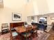 Spacious dining room open to living area, showcasing hardwood floors and elegant furnishings at 2552 E Alameda Ave # 16, Denver, CO 80209