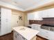 Functional kitchen showcasing ample cabinet space, stainless steel appliances, and hardwood floors at 2552 E Alameda Ave # 16, Denver, CO 80209