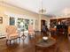 Elegant living room featuring hardwood floors, large windows, and access to additional living space with built-in shelving at 2552 E Alameda Ave # 16, Denver, CO 80209