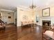 Spacious living room with hardwood floors, fireplace, and large windows, perfect for entertaining or relaxing at 2552 E Alameda Ave # 16, Denver, CO 80209