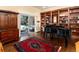 Inviting living room with a built-in bookcase, and a sliding glass door to access the outdoor living space at 2552 E Alameda Ave # 16, Denver, CO 80209