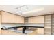 Well-lit office area featuring built-in cabinets and a large desk at 2552 E Alameda Ave # 16, Denver, CO 80209