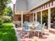 Inviting outdoor patio with brick flooring, stylish seating, and covered lounge area, ideal for relaxing and enjoying the outdoors at 2552 E Alameda Ave # 16, Denver, CO 80209