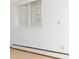 Image of a room featuring a baseboard heater and a window at 2552 E Alameda Ave # 16, Denver, CO 80209