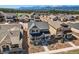 Residential area showcasing a beautiful home nestled among other houses and green trees at 668 Sage Forest Ln, Monument, CO 80132