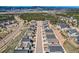 Wide aerial shot of new homes in a residential neighborhood along a street with sidewalks at 668 Sage Forest Ln, Monument, CO 80132