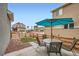 Inviting backyard with patio furniture, gravel, a small lawn, and mountain views at 668 Sage Forest Ln, Monument, CO 80132