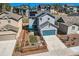 Picture of the backyard with new fence, small patio with umbrella and a small patch of grass at 668 Sage Forest Ln, Monument, CO 80132