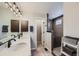 This primary bathroom features a double vanity, modern fixtures, and a glass-enclosed shower for a spa-like experience at 668 Sage Forest Ln, Monument, CO 80132