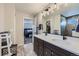 Primary bathroom features a double vanity, modern fixtures, and a glass-enclosed shower for a spa-like experience at 668 Sage Forest Ln, Monument, CO 80132