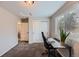 Bright, carpeted bedroom with a desk, closet, and natural light from the window at 668 Sage Forest Ln, Monument, CO 80132