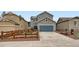 Attractive two-story home with a well-manicured lawn, driveway, and inviting curb appeal at 668 Sage Forest Ln, Monument, CO 80132