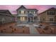 Charming two-story home with a covered front porch and landscaped front yard at 668 Sage Forest Ln, Monument, CO 80132