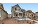 Beautiful two-story home with a covered front porch, and a well-maintained front yard at 668 Sage Forest Ln, Monument, CO 80132