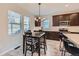 Cozy dining area connected to kitchen featuring ample natural light and stylish furnishings for memorable meals at 668 Sage Forest Ln, Monument, CO 80132