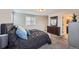 Relax in this main bedroom featuring soft carpet, natural light, and sleek furnishings for a serene retreat at 668 Sage Forest Ln, Monument, CO 80132
