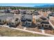 Beautiful neighborhood featuring well-maintained homes, sidewalks, and scenic views of mountains in the distance at 668 Sage Forest Ln, Monument, CO 80132