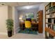 Charming basement office featuring built-in shelving and a yellow chair at 4723 S Pagosa Way, Aurora, CO 80015