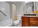 Full bathroom featuring a tiled shower, vanity with granite top, and a toilet at 4723 S Pagosa Way, Aurora, CO 80015