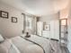 Cozy bedroom with neutral tones, wood flooring, and ample closet space at 4723 S Pagosa Way, Aurora, CO 80015
